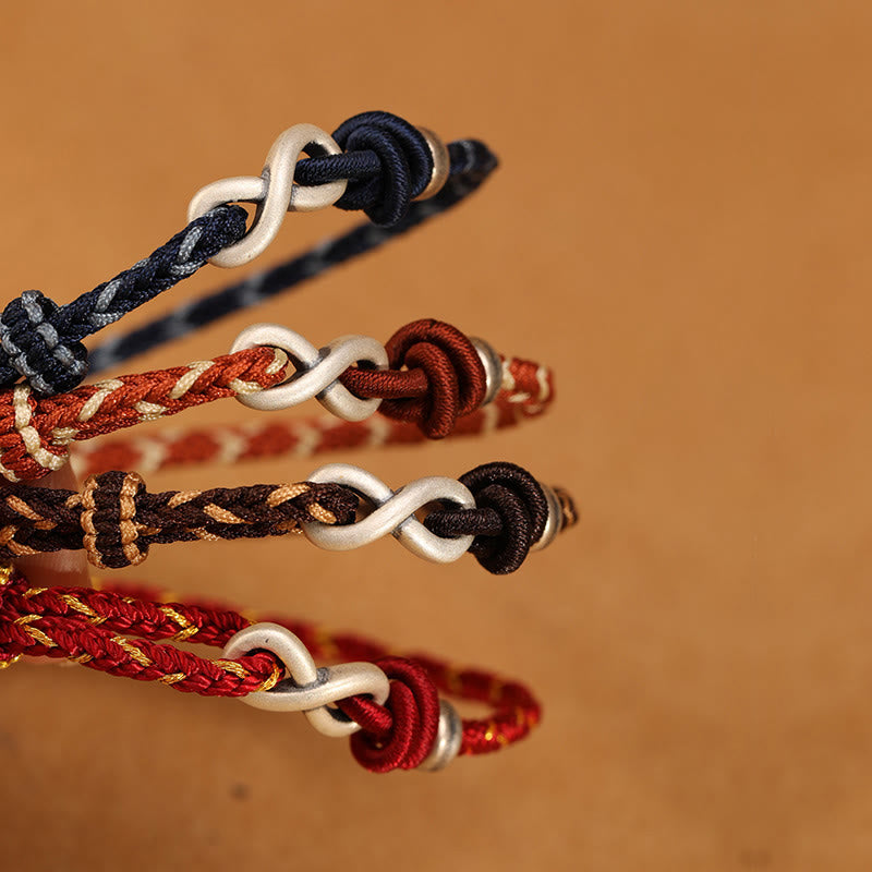Bracelet unisexe en fil rouge de 14 à 18 cm avec nœud infini en argent sterling