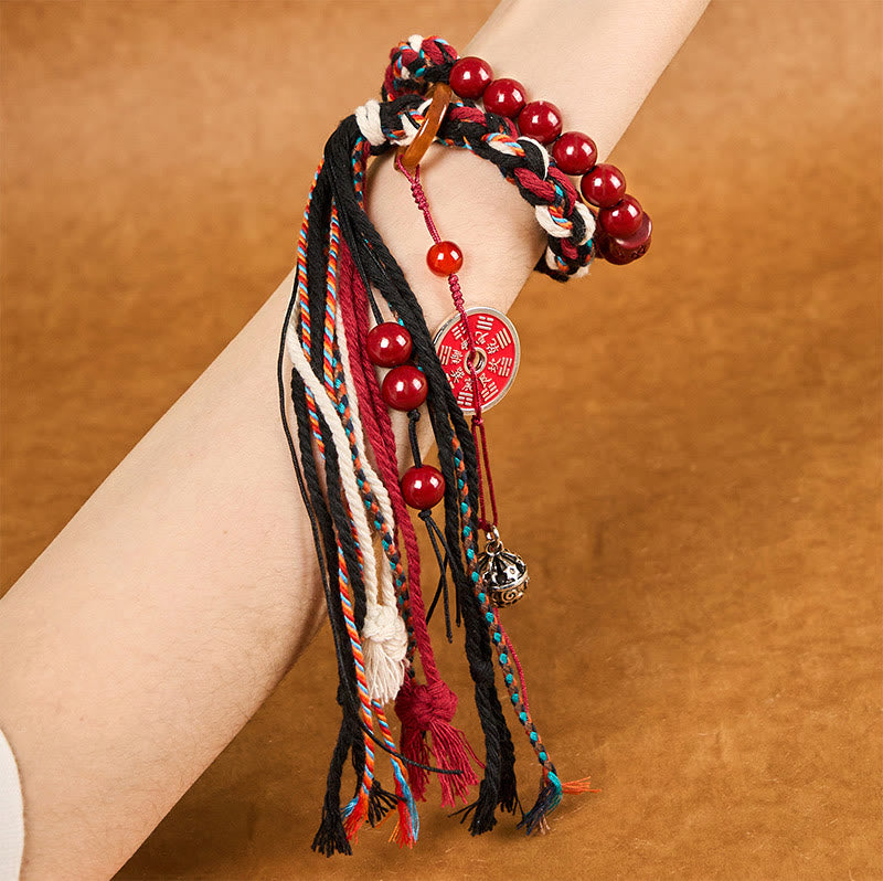 Bracelet unisexe en cinabre avec pompon en corde rouge tibétaine