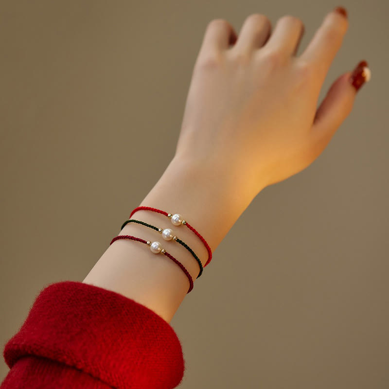 Bracelet porte-bonheur unisexe en perles de 6 mm sur fil rouge