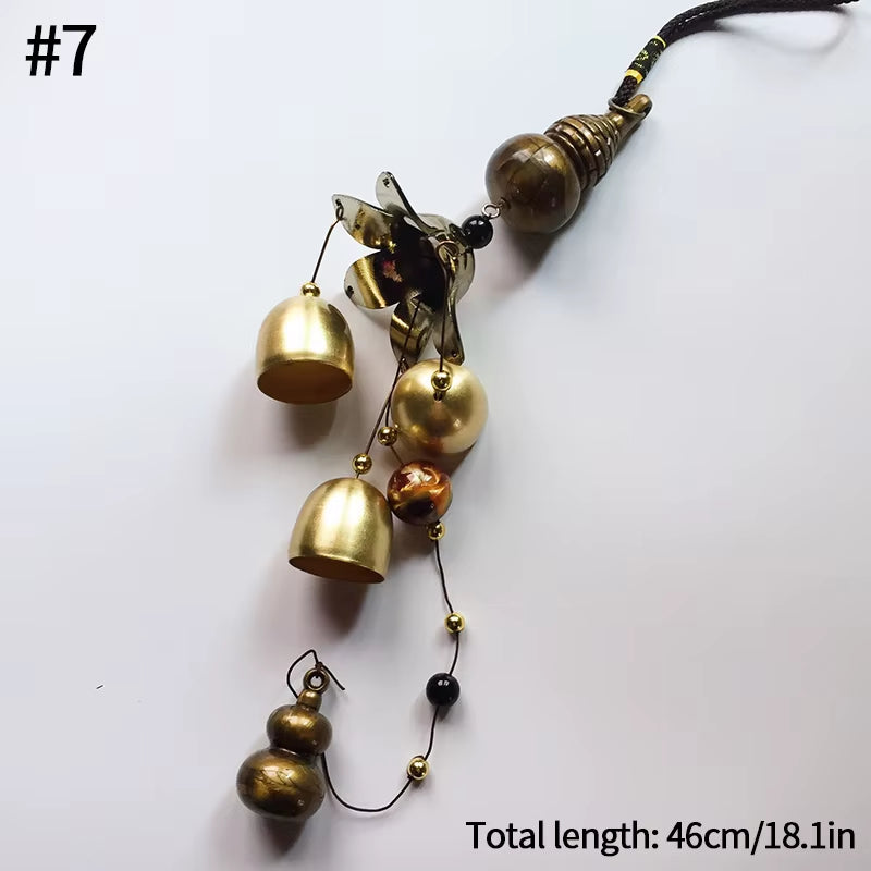 Vintage Metal Wind Chime featuring decorative brass bells on a dark cord for garden decor