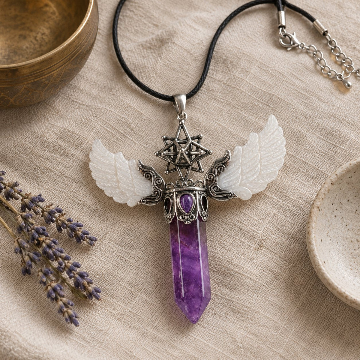Vintage Wing Crystal Pendant 3.1in Spiritual Necklace, styled with a singing bowl and lavender