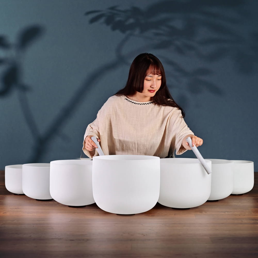 White Frosted Crystal Singing Bowl Set arranged in a curved formation