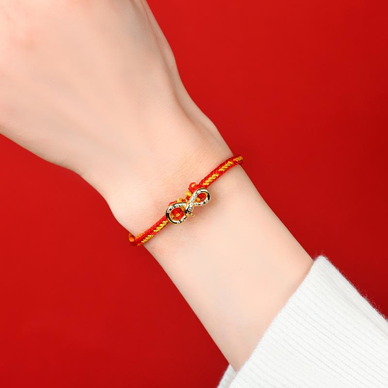Bracelet tressé porte-bonheur en fil rouge Année du Serpent