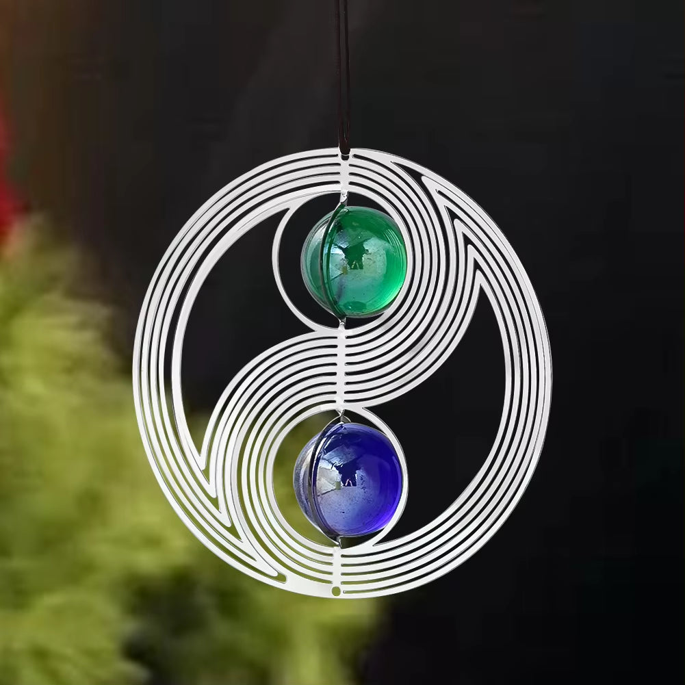 Yin Yang Kinetic Metal Wind Spinner featuring green and blue glass orbs for garden decor